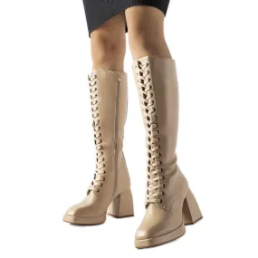 Beige insulated boots with a massive Nova heel